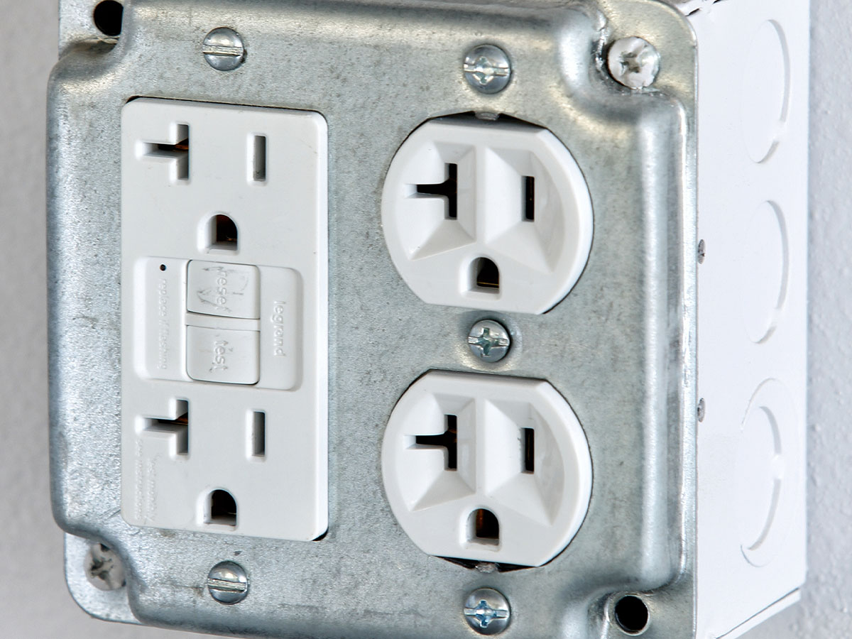 Outlet with GFCI protection.